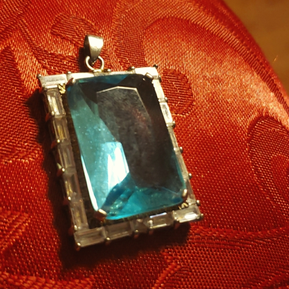Vintage blue topaz pendant costume jewelry some fading.